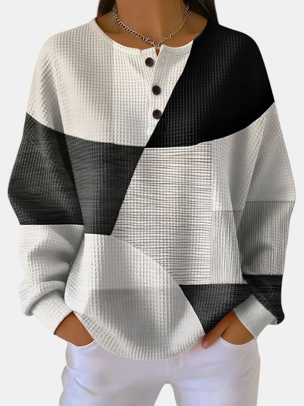 Sweat Emma Genève Ella à motif géométrique noir et blanc, coupe ample avec col boutonné en tissu gaufré doux