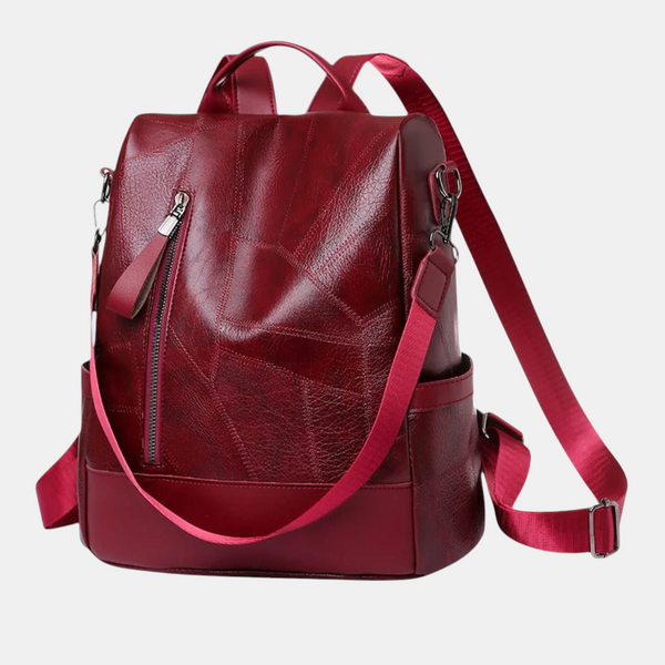 Mochila Emma Genève Freya em pele sintética vermelho-escura com design estruturado, fechos e alças ajustáveis.